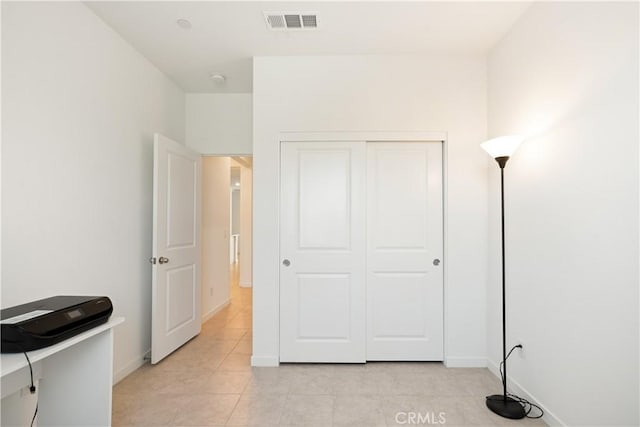 11624 Sky Pointe Dr, Desert Hot Springs, CA 92240 - bedroom featuring light tile patterned floors and a closet
