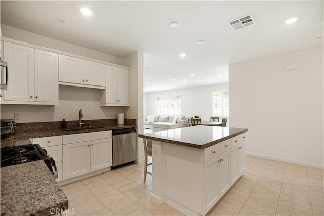 11624 Sky Pointe Dr, Desert Hot Springs, CA 92240 - kitchen with dishwasher, white cabinets, light tile patterned floors, a center island, and recessed lighting