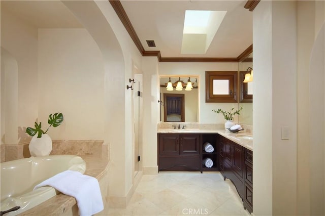 3300 Ocean Blvd, Corona Del Mar, CA 92625 - bathroom featuring double vanity, a garden tub, a skylight, crown molding, and tile patterned floors