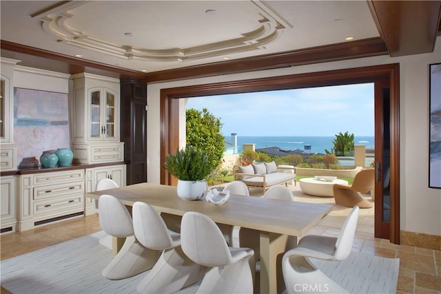 3300 Ocean Blvd, Corona Del Mar, CA 92625 - dining space featuring crown molding, a tray ceiling, stone tile floors, and a water view