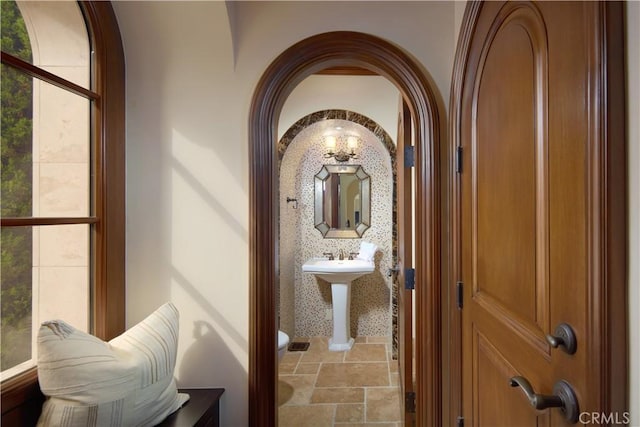 3300 Ocean Blvd, Corona Del Mar, CA 92625 - hall with arched walkways and stone tile flooring