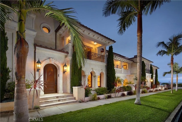 3300 Ocean Blvd, Corona Del Mar, CA 92625 - doorway to property with a lawn, a balcony, and stucco siding