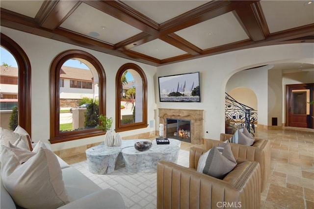 3300 Ocean Blvd, Corona Del Mar, CA 92625 - living room featuring arched walkways, stone tile flooring, a high end fireplace, coffered ceiling, and beamed ceiling
