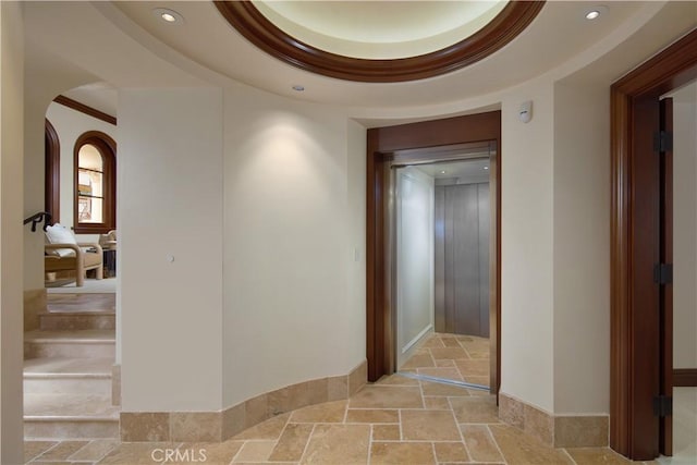3300 Ocean Blvd, Corona Del Mar, CA 92625 - hall featuring stone tile flooring, recessed lighting, arched walkways, and elevator