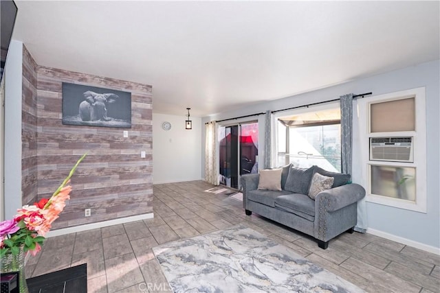 624 Pamela Kay Ln, La Puente, CA 91746 - living room featuring wood tiled floors, an accent wall, and cooling unit