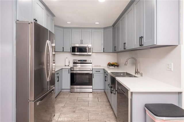 624 Pamela Kay Ln, La Puente, CA 91746 - kitchen featuring stainless steel appliances, gray cabinets, recessed lighting, and light countertops
