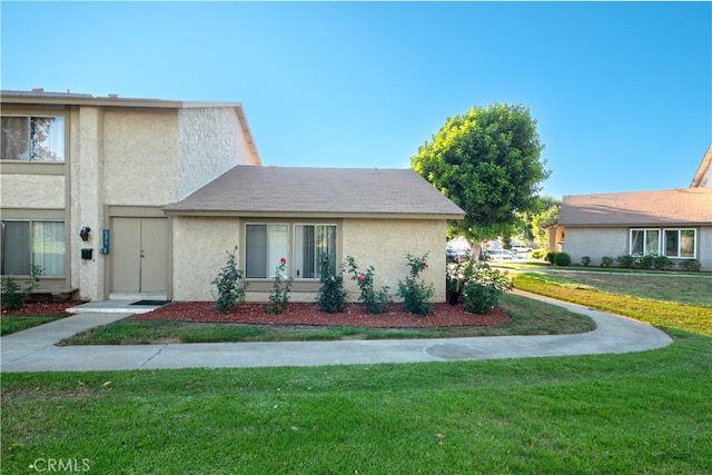 624 Pamela Kay Ln, La Puente, CA 91746 - view of front of house with stucco siding and a front yard