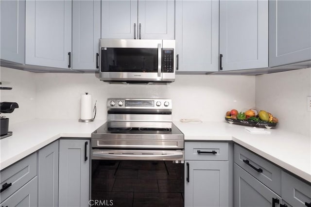 624 Pamela Kay Ln, La Puente, CA 91746 - kitchen featuring appliances with stainless steel finishes, gray cabinets, and light countertops