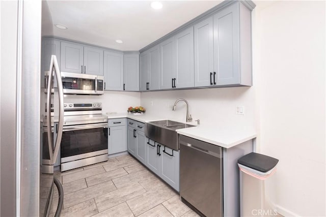 624 Pamela Kay Ln, La Puente, CA 91746 - kitchen featuring stainless steel appliances, gray cabinetry, light countertops, and recessed lighting