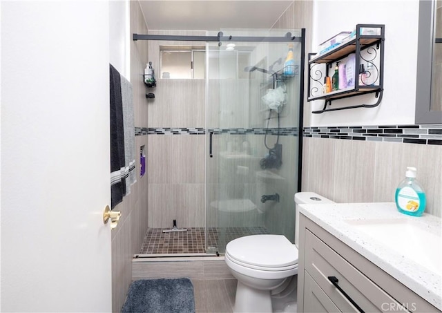 624 Pamela Kay Ln, La Puente, CA 91746 - full bath featuring vanity, a stall shower, tile walls, and tile patterned floors