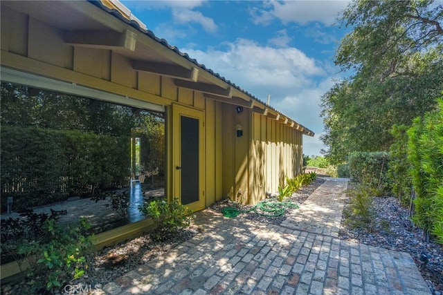 4308 Crown Ranch Rd, Corona, CA 92881 - view of property exterior with a patio area and board and batten siding