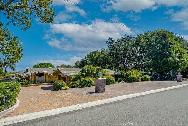 4308 Crown Ranch Rd, Corona, CA 92881 - view of front of house featuring a chimney and a tile roof