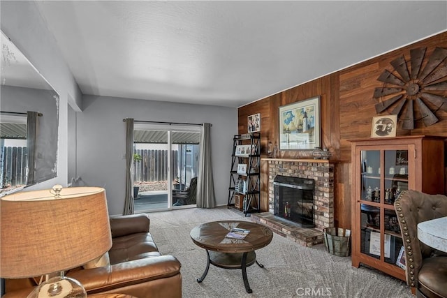 2464 Maclennan St, Napa, CA 94558 - living area with carpet flooring, wooden walls, and a fireplace