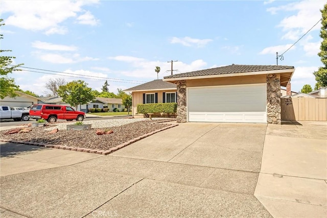 2464 Maclennan St, Napa, CA 94558 - ranch-style house featuring concrete driveway, a tile roof, an attached garage, and stucco siding