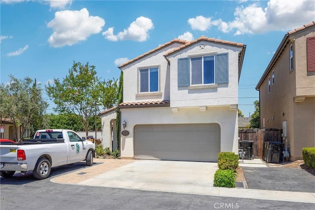 13450 Prosperity Pl, Garden Grove, CA 92843 - mediterranean / spanish-style home featuring a tiled roof, an attached garage, stucco siding, and concrete driveway