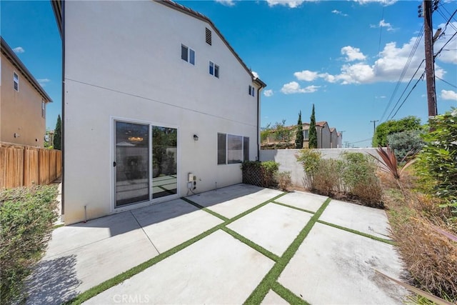 13450 Prosperity Pl, Garden Grove, CA 92843 - rear view of house with stucco siding and a patio