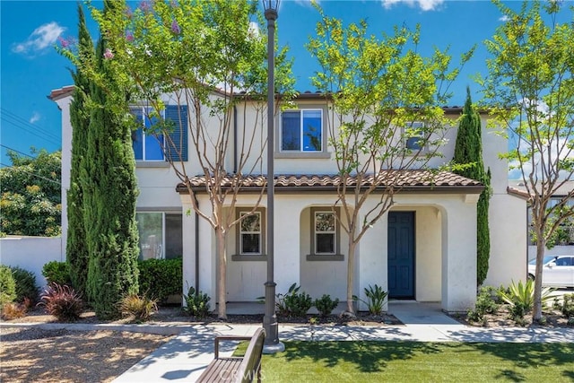 13450 Prosperity Pl, Garden Grove, CA 92843 - view of front of property with stucco siding, a tiled roof, and a front lawn