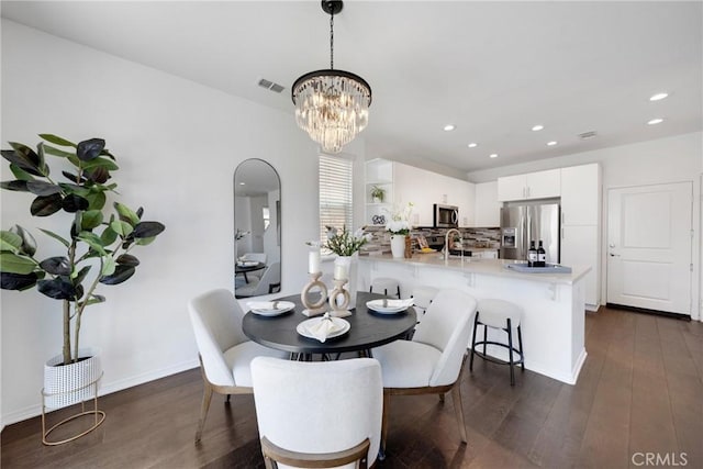 13450 Prosperity Pl, Garden Grove, CA 92843 - dining space with dark wood finished floors, a chandelier, and recessed lighting