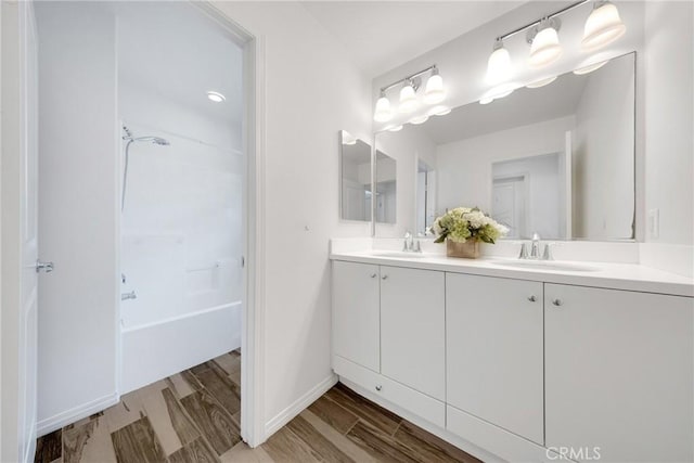 13450 Prosperity Pl, Garden Grove, CA 92843 - full bathroom featuring double vanity, bathing tub / shower combination, and wood finished floors