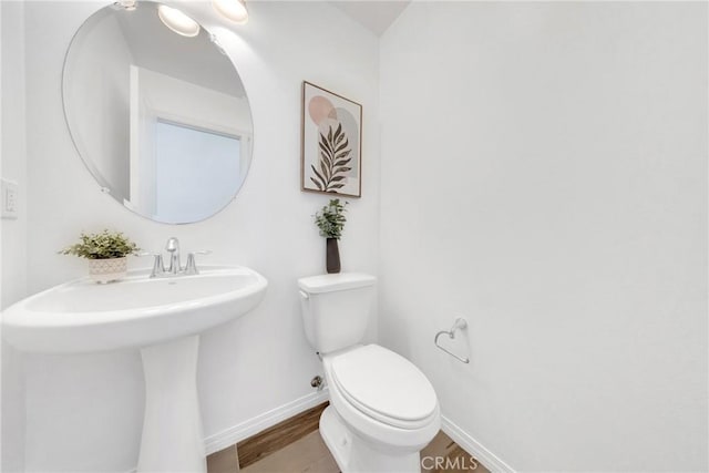 13450 Prosperity Pl, Garden Grove, CA 92843 - half bath featuring toilet and wood finished floors