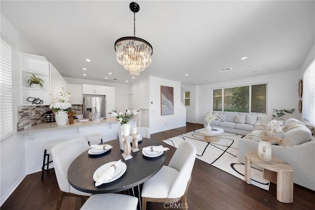 13450 Prosperity Pl, Garden Grove, CA 92843 - dining space with a chandelier, dark wood finished floors, recessed lighting, and plenty of natural light