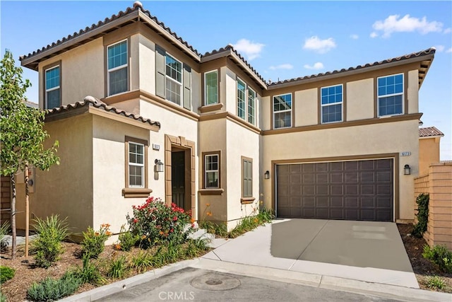 16173 Alamo Ct, Chino, CA 91708 - view of property featuring an attached garage, stucco siding, a tiled roof, and concrete driveway