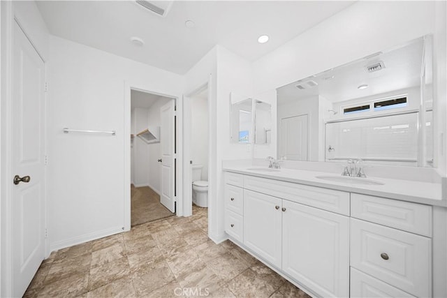16173 Alamo Ct, Chino, CA 91708 - bathroom featuring double vanity and toilet