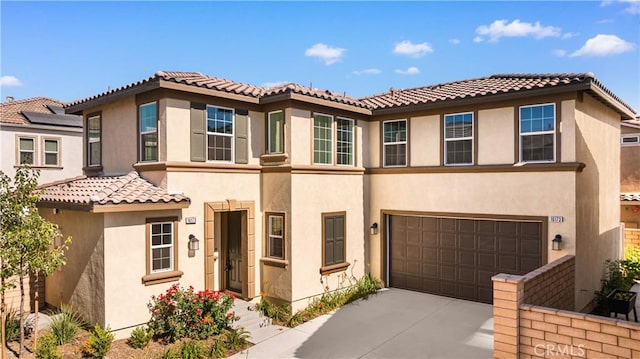 16173 Alamo Ct, Chino, CA 91708 - view of front of property featuring stucco siding, a garage, a tiled roof, and driveway