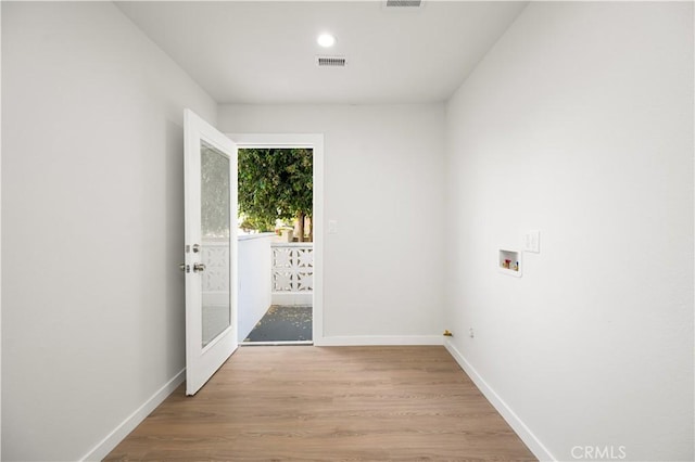 1604 W 125th St, Los Angeles, CA 90047 - empty room featuring wood finished floors, recessed lighting, and french doors