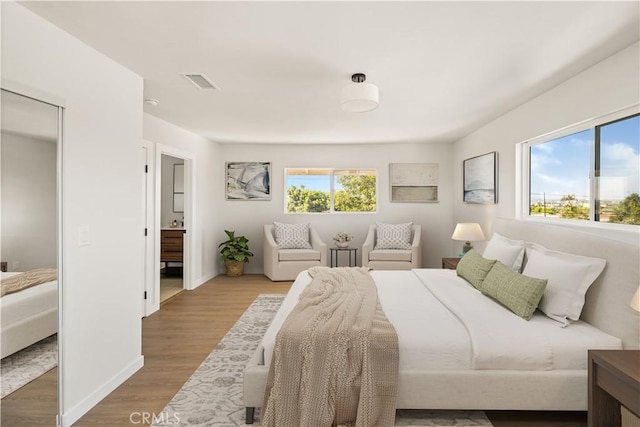 1604 W 125th St, Los Angeles, CA 90047 - bedroom featuring wood finished floors and ensuite bathroom