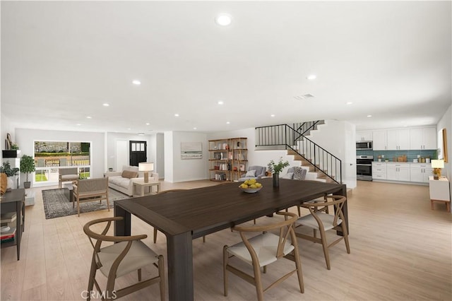 1604 W 125th St, Los Angeles, CA 90047 - dining space with recessed lighting, stairway, and light wood finished floors