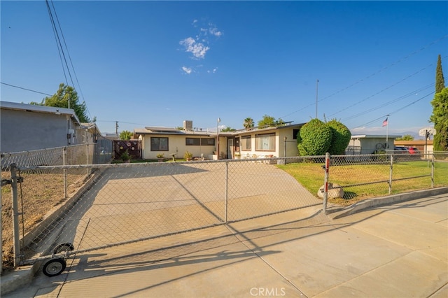 618 E 2nd St, Rialto, CA 92376 - ranch-style house featuring roof mounted solar panels