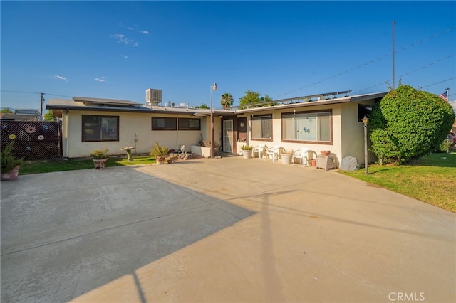618 E 2nd St, Rialto, CA 92376 - ranch-style house with stucco siding and solar panels
