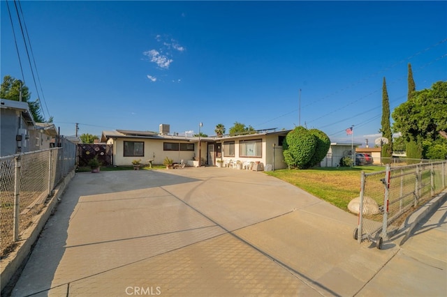 618 E 2nd St, Rialto, CA 92376 - ranch-style home featuring roof mounted solar panels