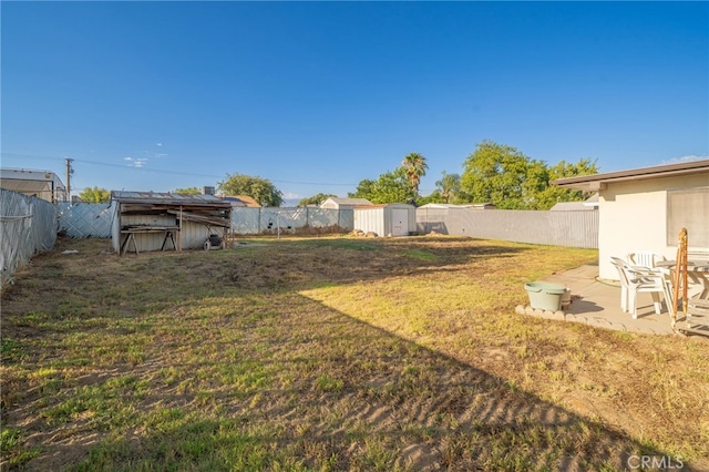 618 E 2nd St, Rialto, CA 92376 - fenced backyard featuring a storage unit