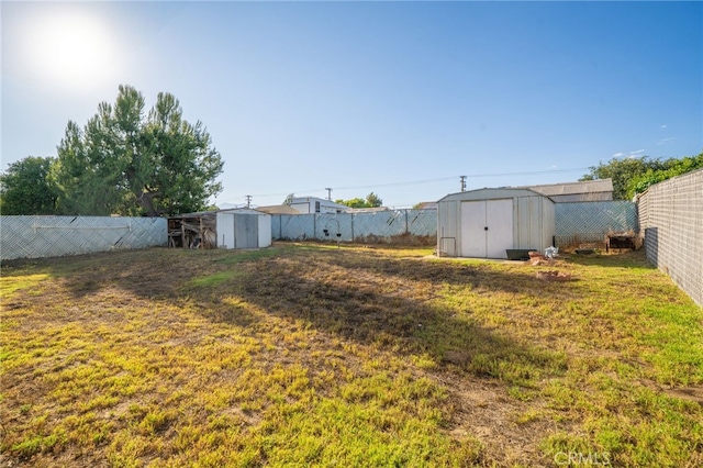 618 E 2nd St, Rialto, CA 92376 - fenced backyard with a shed