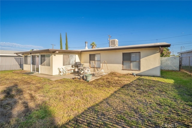 618 E 2nd St, Rialto, CA 92376 - rear view of property with stucco siding and a patio area