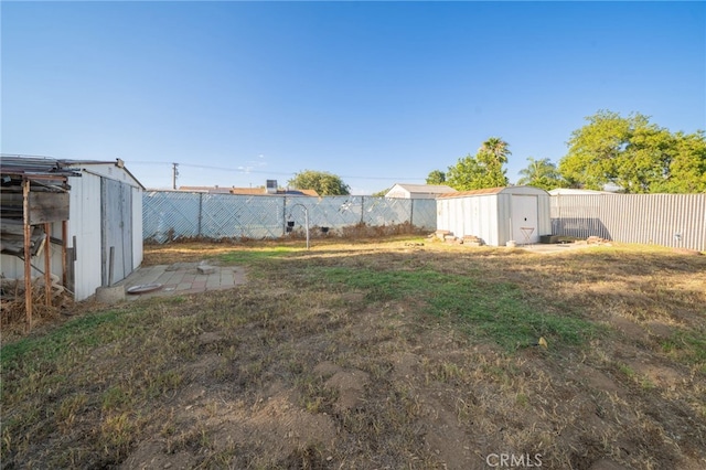 618 E 2nd St, Rialto, CA 92376 - fenced backyard featuring a storage shed