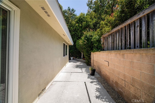 1575 Via Capri Unit 6, Laguna Beach, CA 92651 - view of side of home featuring stucco siding and a patio