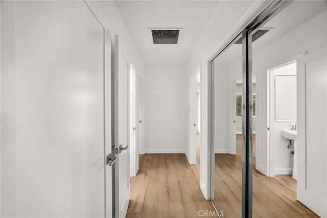 1575 Via Capri Unit 6, Laguna Beach, CA 92651 - hall featuring light wood finished floors and baseboards