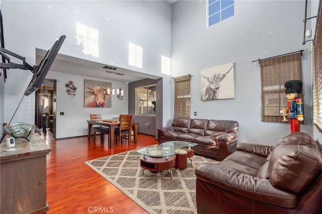 7459 Melanie Ct, Highland, CA 92346 - living room with wood finished floors and a high ceiling