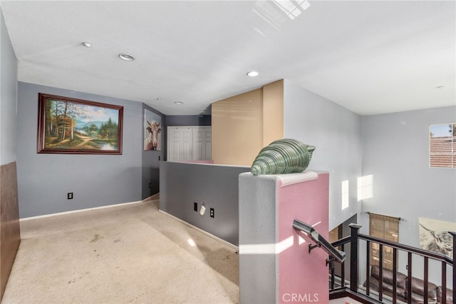 7459 Melanie Ct, Highland, CA 92346 - corridor with an upstairs landing, carpet flooring, and recessed lighting