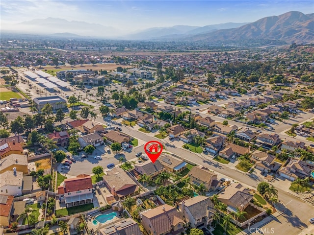 7459 Melanie Ct, Highland, CA 92346 - aerial view of property's location with mountains and nearby suburban area