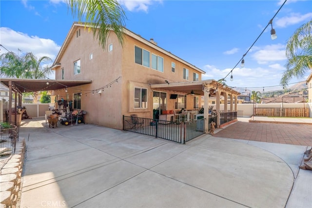7459 Melanie Ct, Highland, CA 92346 - rear view of property featuring a patio, a fenced backyard, and stucco siding