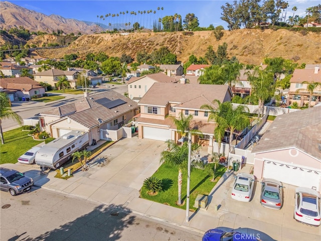 7459 Melanie Ct, Highland, CA 92346 - aerial perspective of suburban area with a mountain backdrop