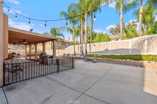 7459 Melanie Ct, Highland, CA 92346 - fenced backyard with ceiling fan, a patio, and area for grilling