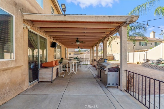 7459 Melanie Ct, Highland, CA 92346 - fenced backyard with ceiling fan, a patio, a grill, and outdoor dining space
