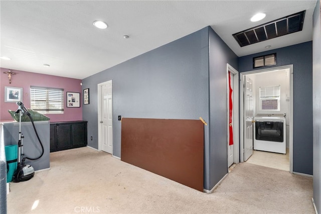 7459 Melanie Ct, Highland, CA 92346 - hall with carpet, washer / dryer, and recessed lighting