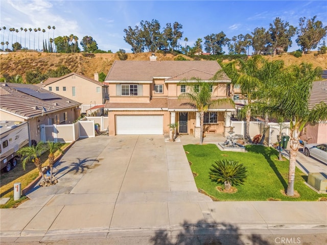 7459 Melanie Ct, Highland, CA 92346 - traditional-style home featuring concrete driveway, stucco siding, a garage, a tile roof, and a gate
