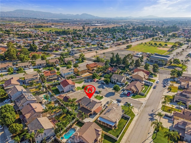 7459 Melanie Ct, Highland, CA 92346 - aerial view of property and surrounding area featuring a mountainous background and nearby suburban area